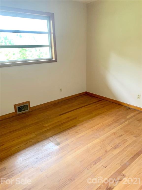 379 South Goforth Road Ferguson, NC 28624 - Photo 10 of 16 a view of empty room with wooden floor
