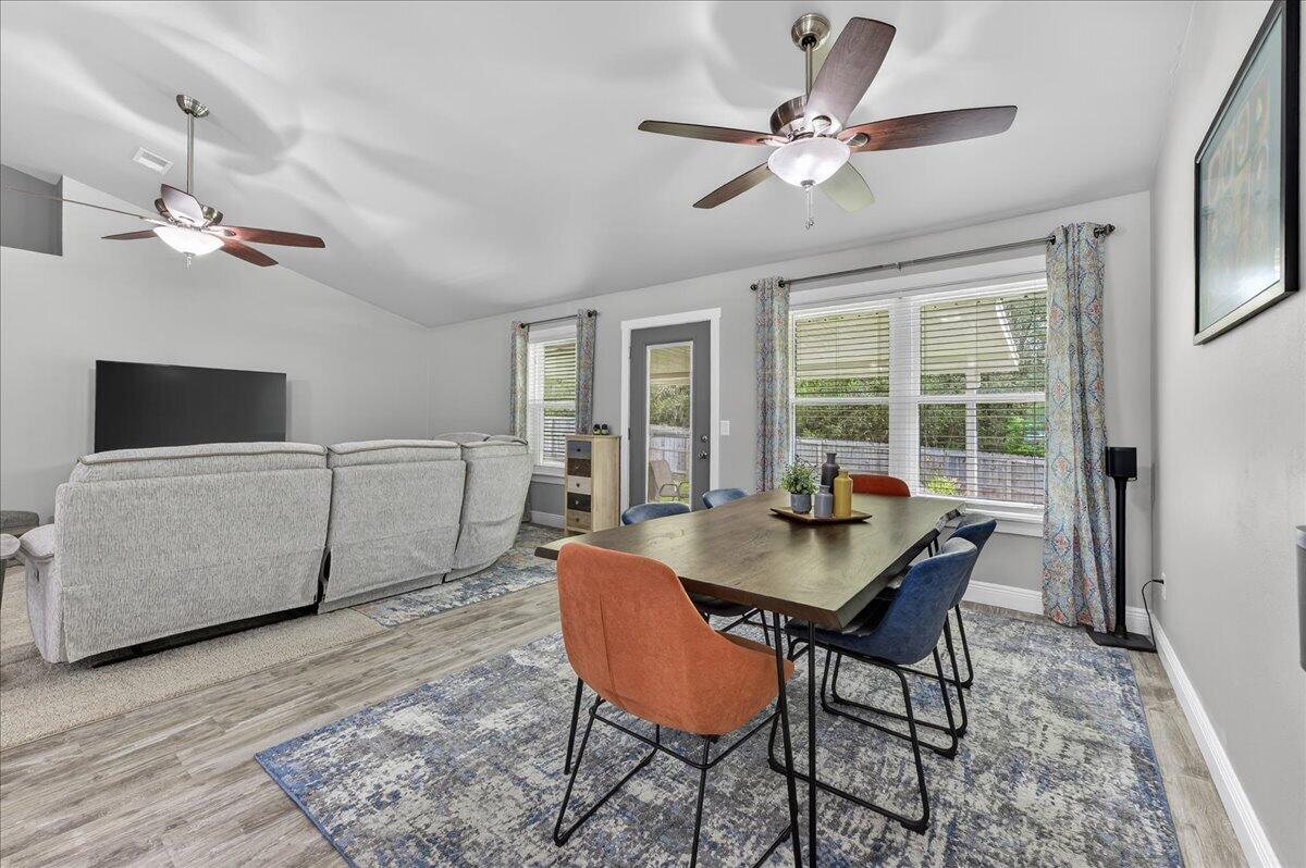 5328 Whitney Court Crestview, FL 32536 - Photo 11 of 48 a view of a dining room with furniture window and wooden floor