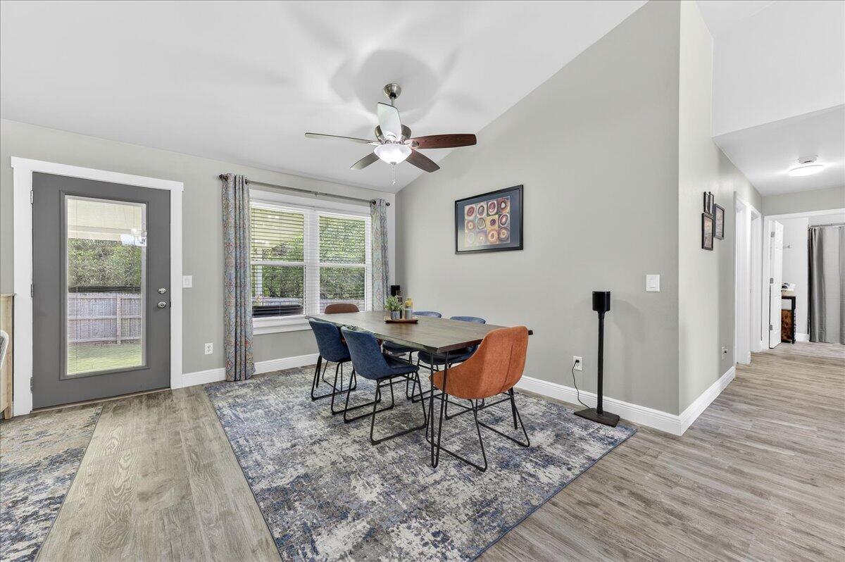 5328 Whitney Court Crestview, FL 32536 - Photo 12 of 48 a view of a dining room with furniture window and wooden floor
