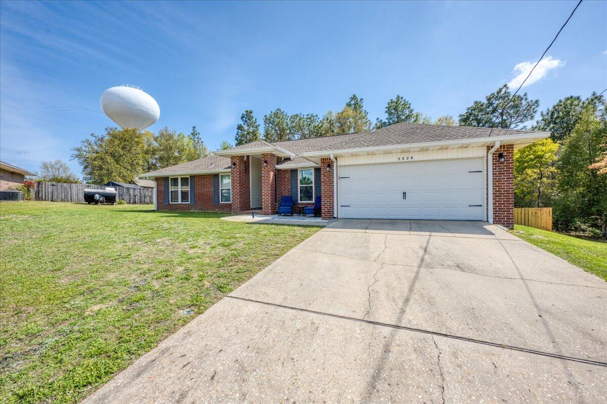 5328 Whitney Court Crestview, FL 32536 - Photo 2 of 48 a view of a house with a yard and potted plants