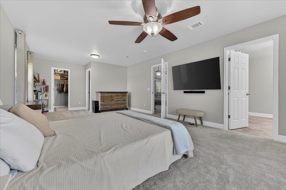 5328 Whitney Court Crestview, FL 32536 - Photo 25 of 48 a bedroom with a bed and a flat screen tv
