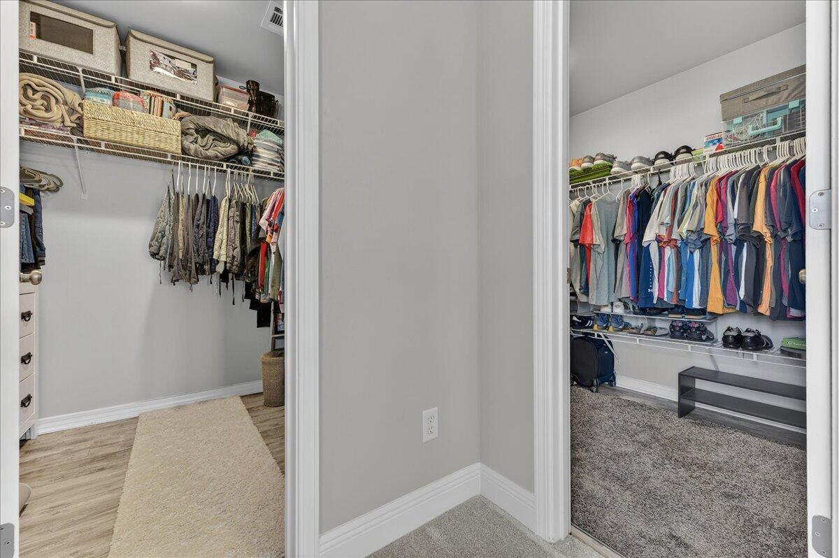 5328 Whitney Court Crestview, FL 32536 - Photo 27 of 48 a view of walk in closet with clothes and shoes