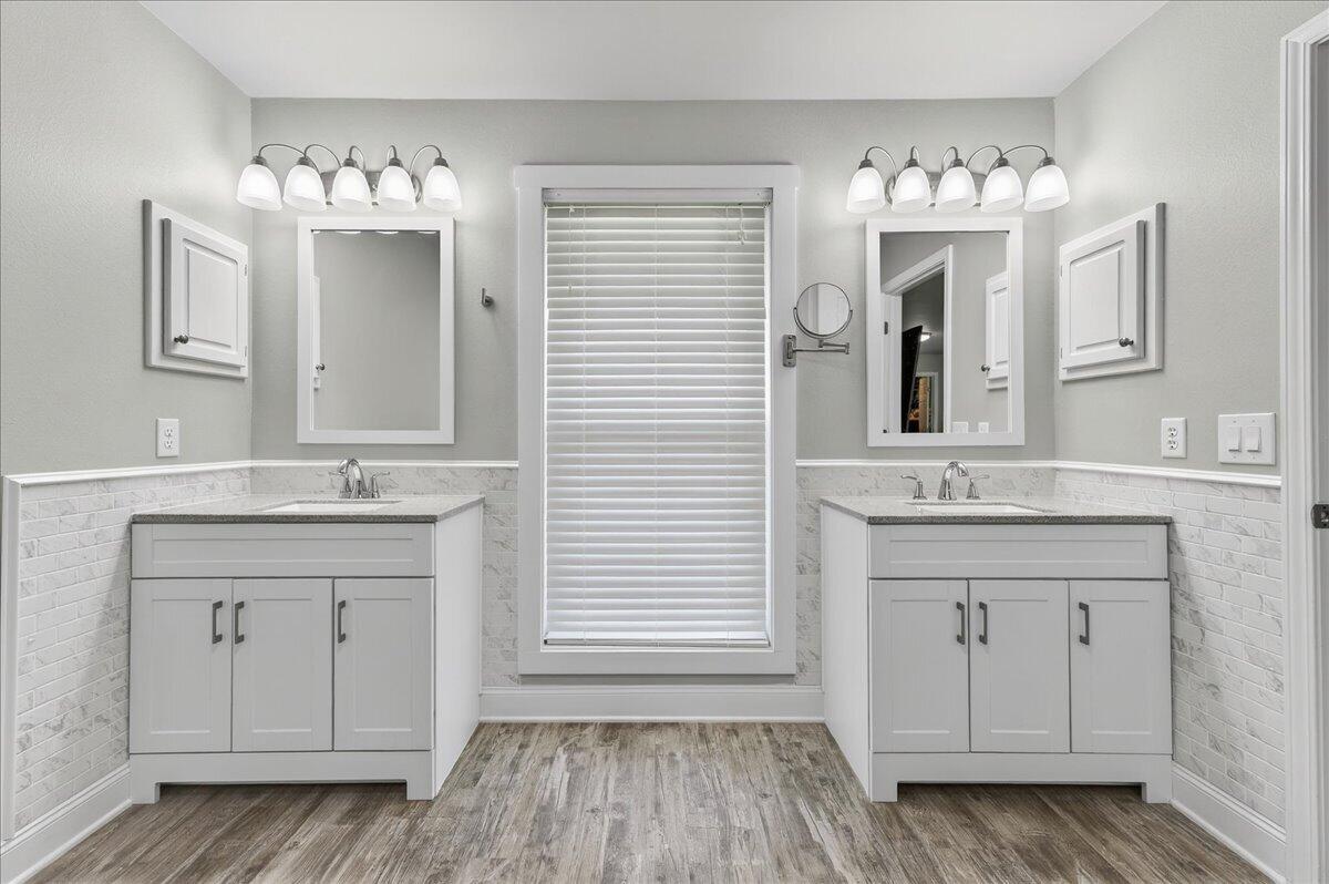 5328 Whitney Court Crestview, FL 32536 - Photo 28 of 48 a bathroom with a sink vanity and mirror