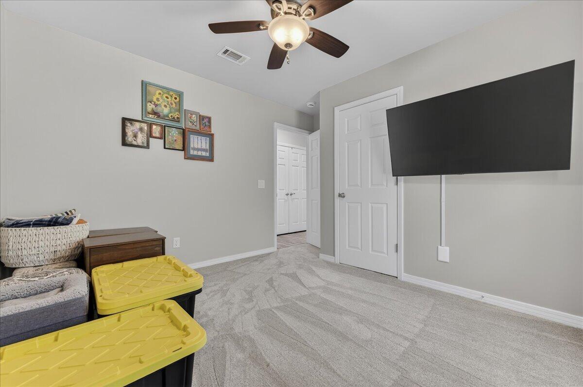 5328 Whitney Court Crestview, FL 32536 - Photo 35 of 48 a living room with furniture and a flat screen tv