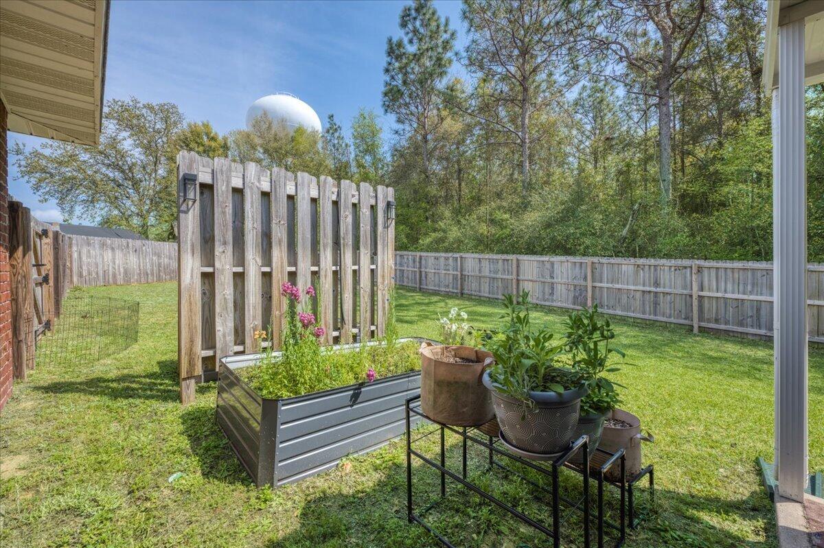 5328 Whitney Court Crestview, FL 32536 - Photo 43 of 48 a view of a two chairs in the garden