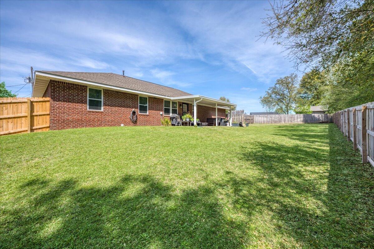 5328 Whitney Court Crestview, FL 32536 - Photo 45 of 48 a view of a house with a yard and sitting area