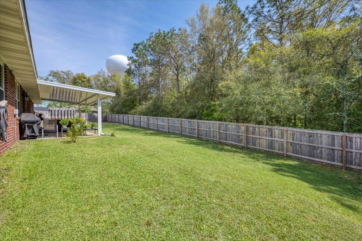 5328 Whitney Court Crestview, FL 32536 - Photo 46 of 48 a view of a backyard with a garden and plants