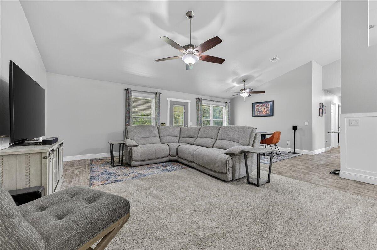 5328 Whitney Court Crestview, FL 32536 - Photo 9 of 48 a living room with furniture and a flat screen tv
