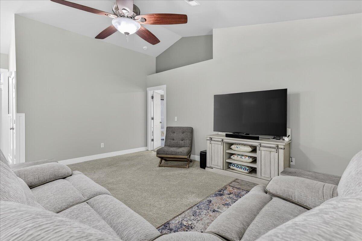 5328 Whitney Court Crestview, FL 32536 - Photo 10 of 48 a living room with furniture and a flat screen tv