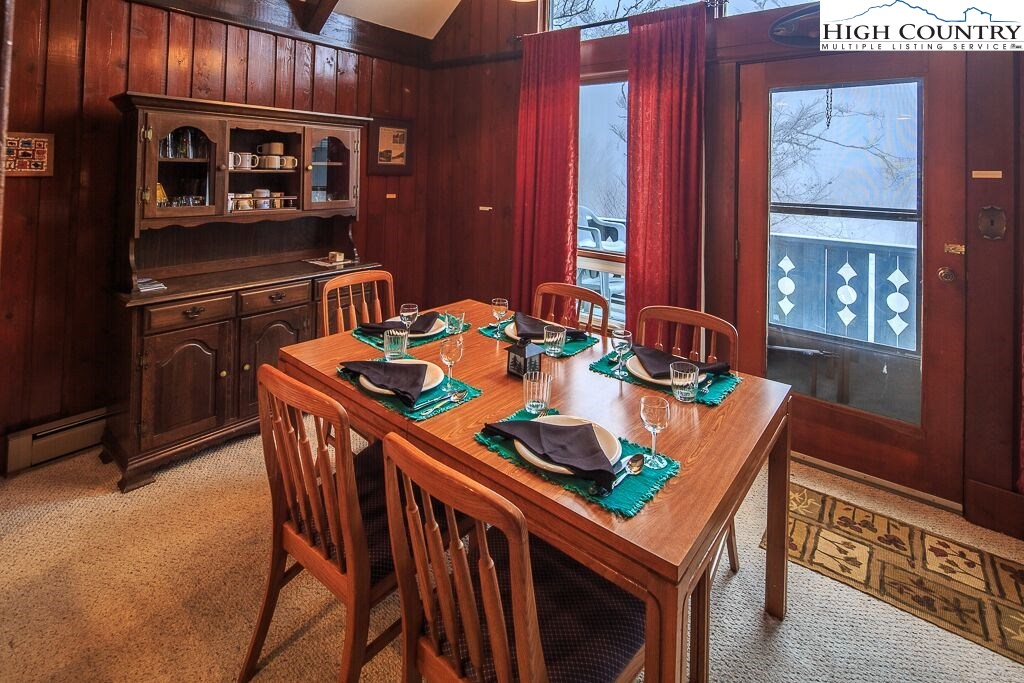 105 North Pinnacle Ridge Road, Unit MNC I # 7 Beech Mountain, NC 28604 - Photo 8 of 39 a dining room with furniture and window