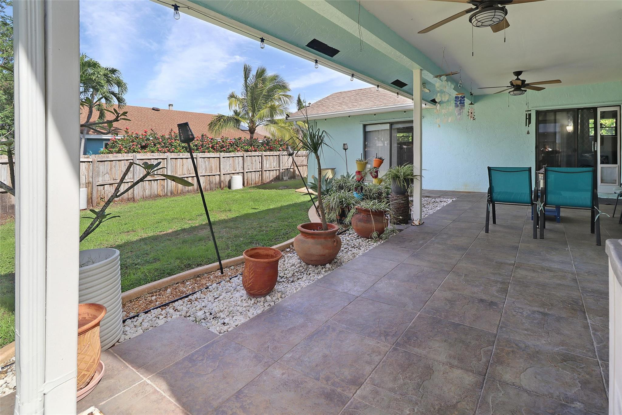 231 Southeast 9th Street Dania Beach, FL 33004 - Photo 13 of 27 a view of a porch with furniture and a yard