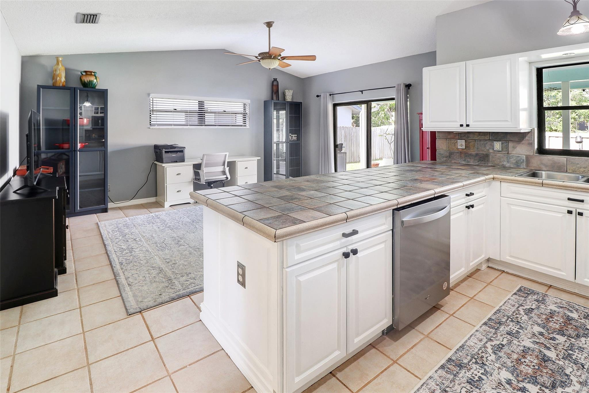 231 Southeast 9th Street Dania Beach, FL 33004 - Photo 25 of 27 a kitchen with stainless steel appliances granite countertop a sink stove and cabinets