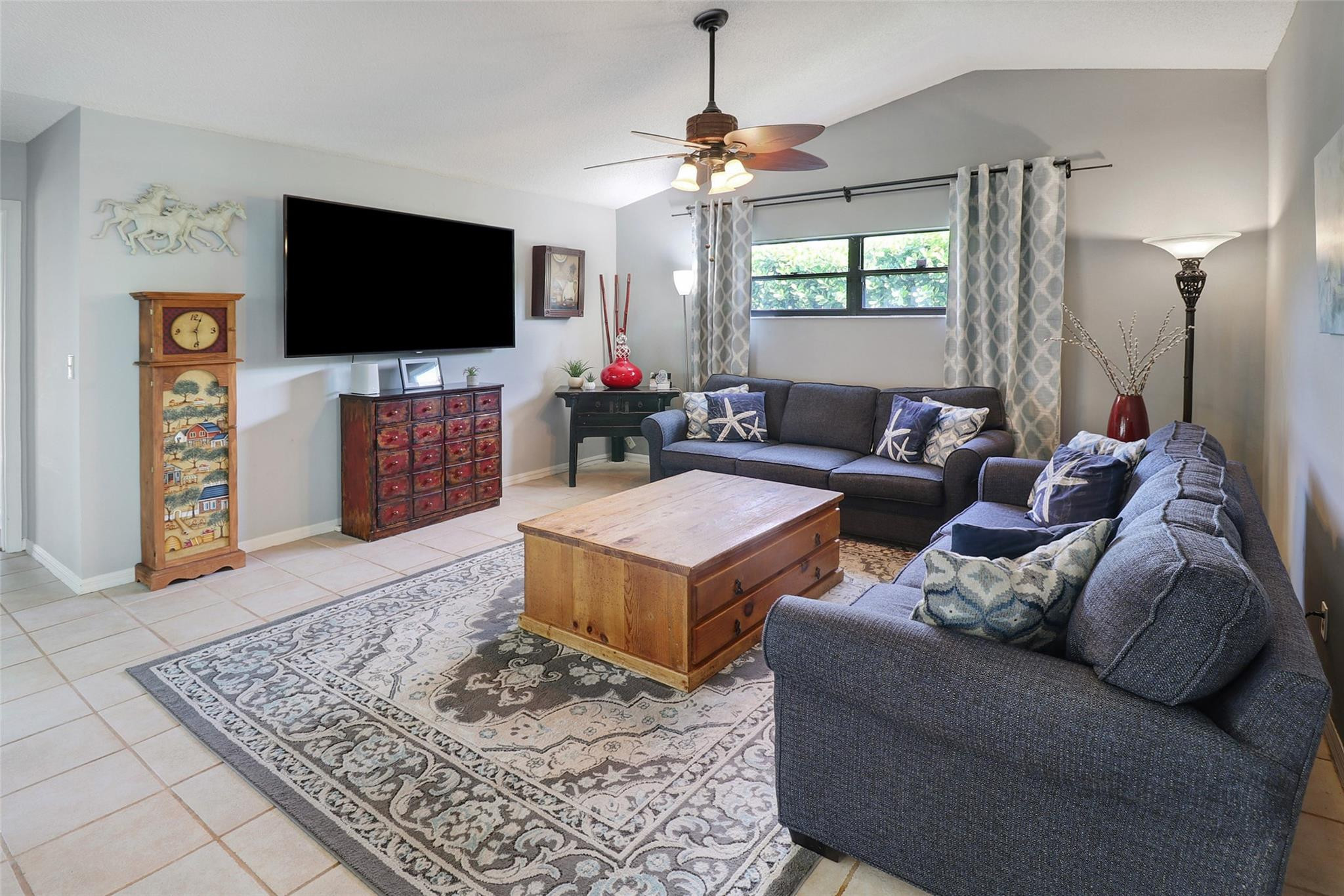 231 Southeast 9th Street Dania Beach, FL 33004 - Photo 3 of 27 a living room with furniture and a flat screen tv