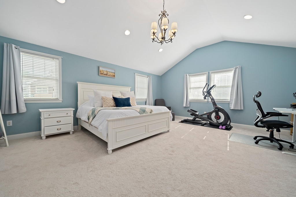 54 Birchcroft Road Canton, MA 02021 - Photo 24 of 37 a bedroom with bed and a chandelier