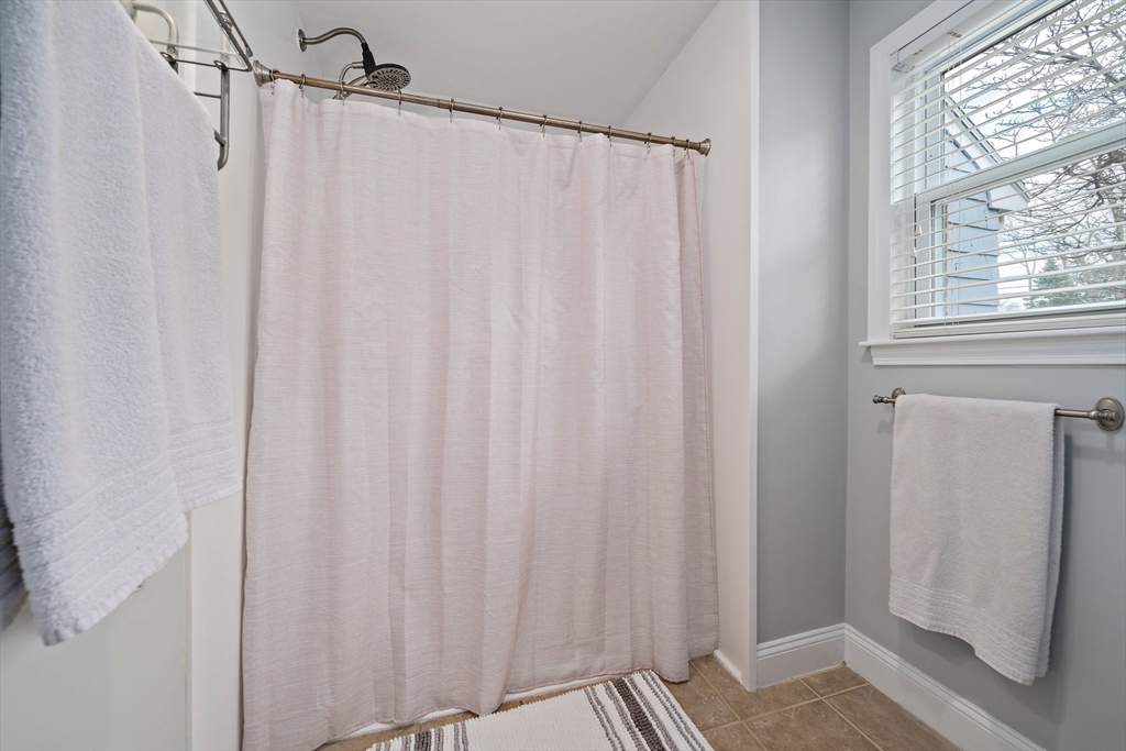54 Birchcroft Road Canton, MA 02021 - Photo 28 of 37 a view of a bathroom with a shower curtain