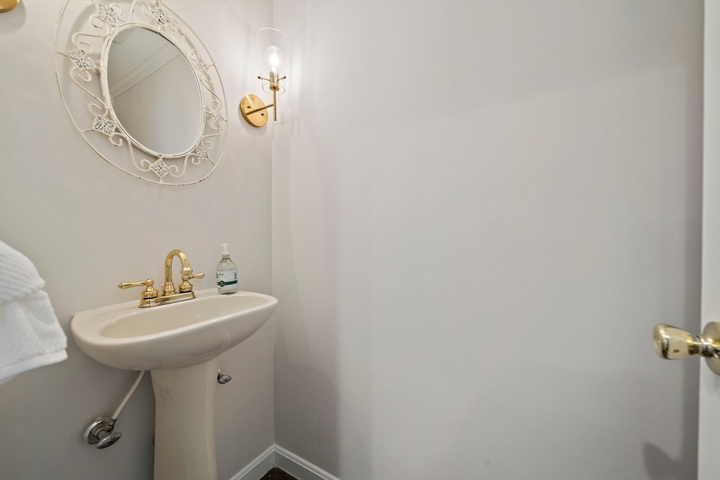 54 Birchcroft Road Canton, MA 02021 - Photo 29 of 37 a bathroom with a sink a mirror and vanity