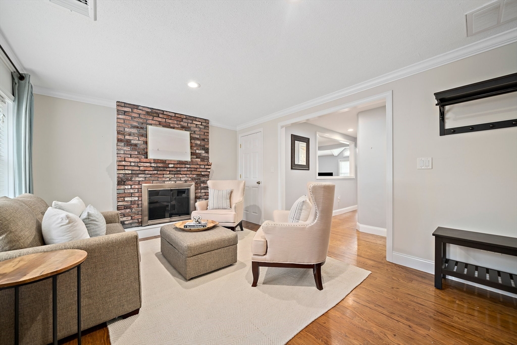 54 Birchcroft Road Canton, MA 02021 - Photo 30 of 37 a living room with furniture and a fireplace