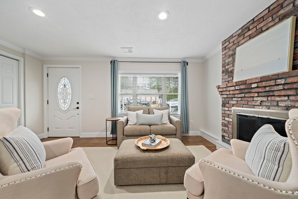 54 Birchcroft Road Canton, MA 02021 - Photo 31 of 37 a living room with furniture or couch and a fireplace