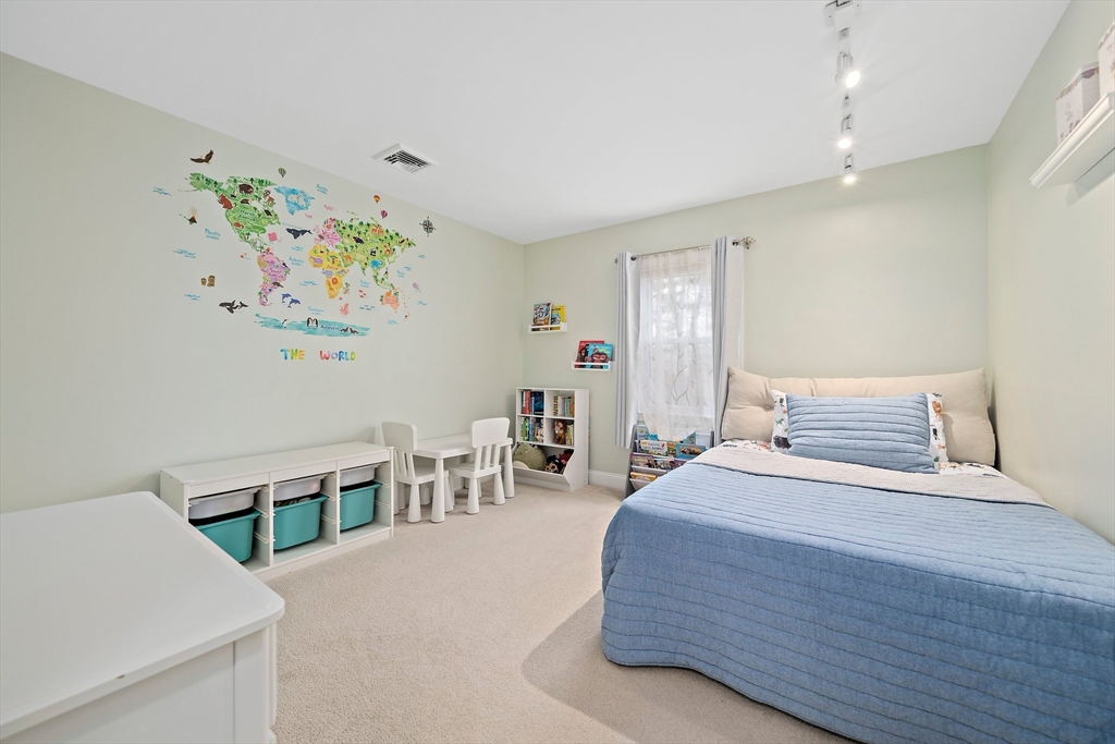 54 Birchcroft Road Canton, MA 02021 - Photo 33 of 37 a bedroom with a bed and furniture