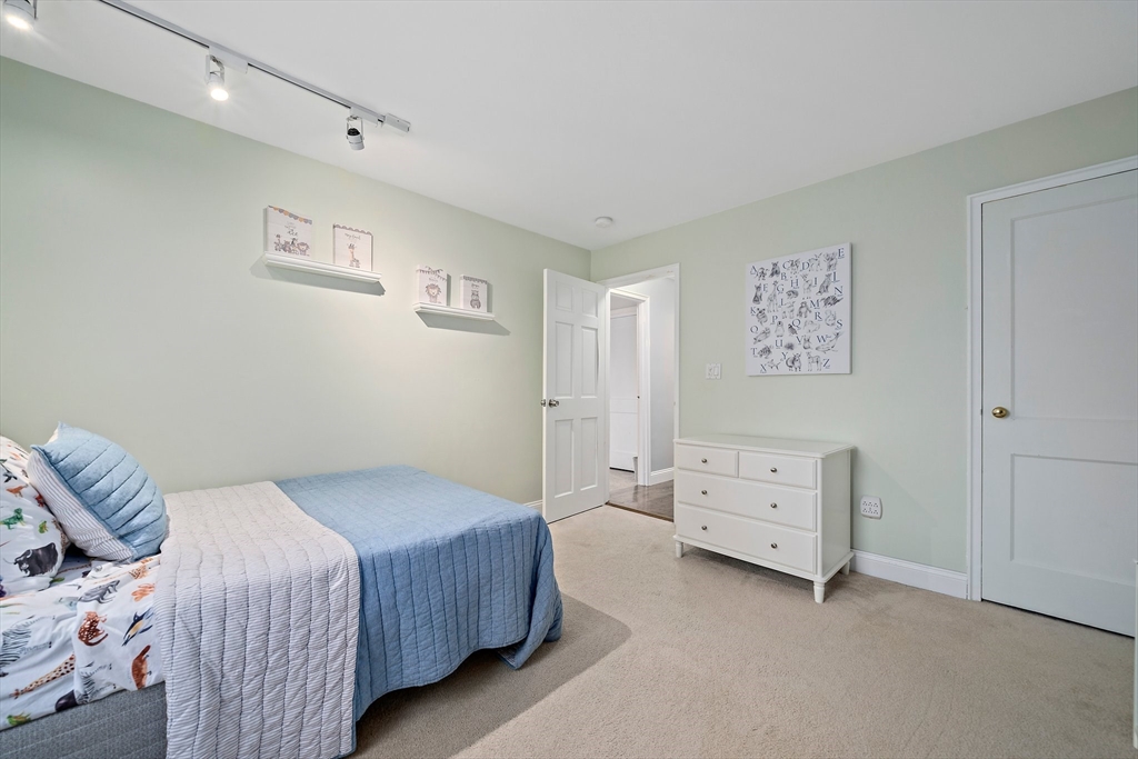 54 Birchcroft Road Canton, MA 02021 - Photo 34 of 37 a bedroom with a bed and a cabinets