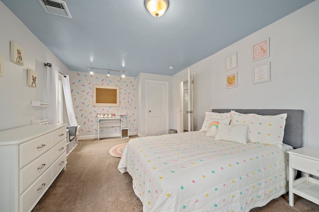 54 Birchcroft Road Canton, MA 02021 - Photo 36 of 37 a spacious bedroom with a bed and a cabinets
