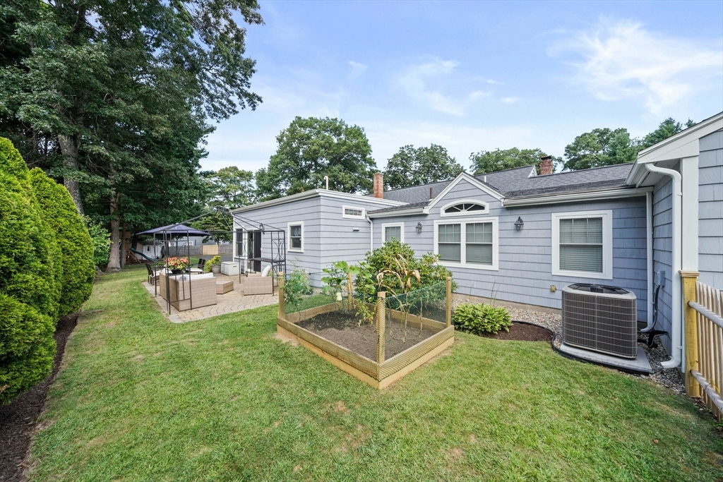 54 Birchcroft Road Canton, MA 02021 - Photo 6 of 37 a view of a house with backyard sitting area and garden