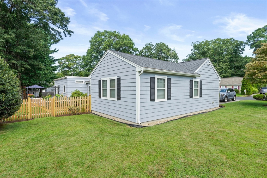 54 Birchcroft Road Canton, MA 02021 - Photo 7 of 37 a view of a house with a yard and sitting area