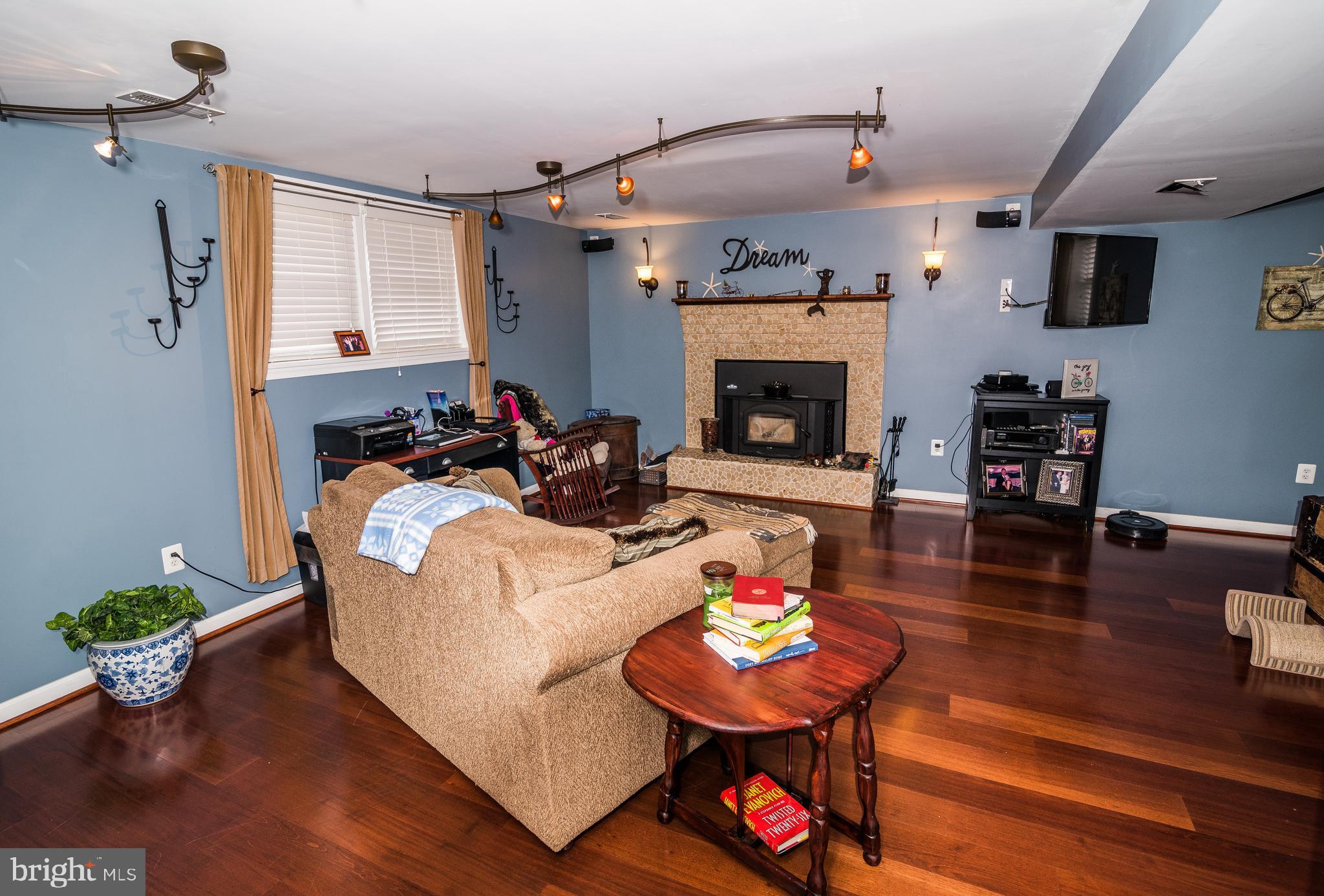 11706 Rivershore Drive Dunkirk, MD 20754 - Photo 24 of 71 a living room with furniture and a fireplace