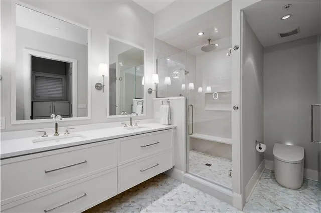 a white bath tub sitting next to a bathroom sink