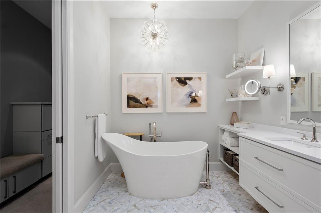 301 Fifth Avenue, Unit 720 Pittsburgh, PA 15222 - Photo 20 of 49 a white bath tub sitting next to a bathroom sink
