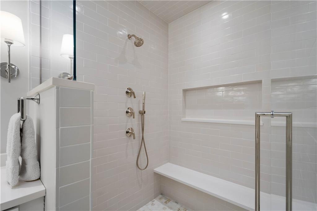 301 Fifth Avenue, Unit 720 Pittsburgh, PA 15222 - Photo 22 of 49 a bathroom with a shower and toilet