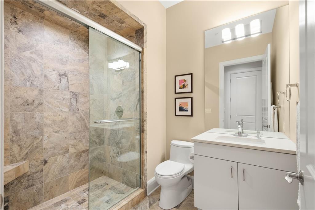 301 Fifth Avenue, Unit 720 Pittsburgh, PA 15222 - Photo 25 of 49 a bathroom with a sink and a mirror