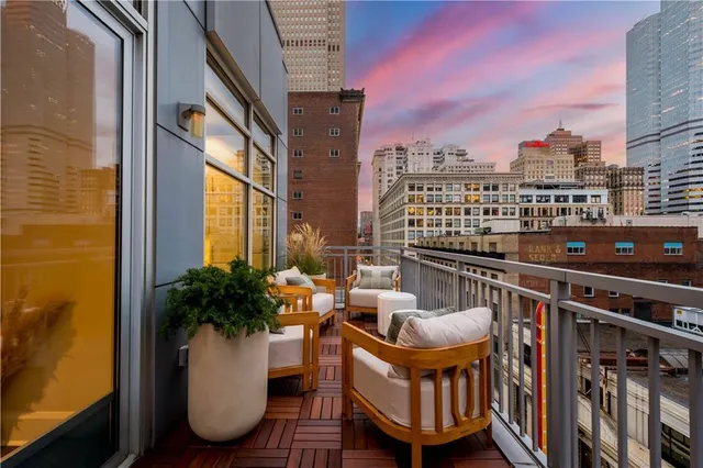 a view of a balcony with chairs