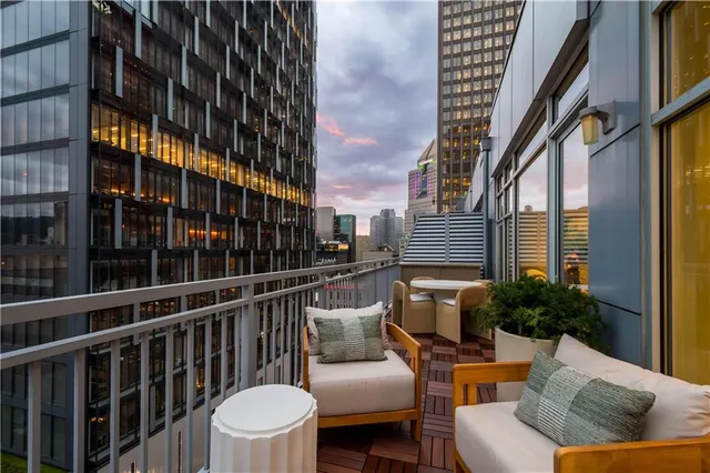 a building view with outdoor seating