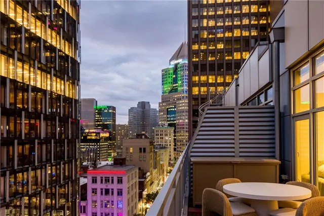 a outdoor space with patio the couches and a dining table with chairs