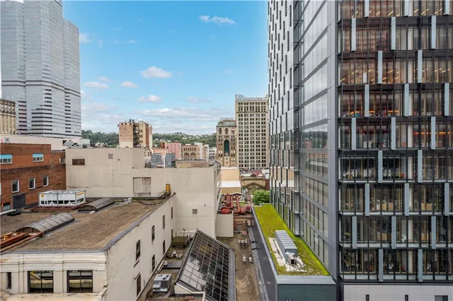 a spacious bathroom with a double vanity sink and a mirror