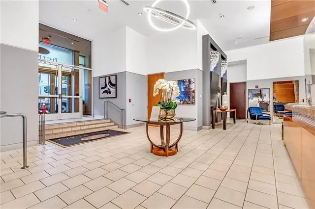 a living room with furniture and a clock