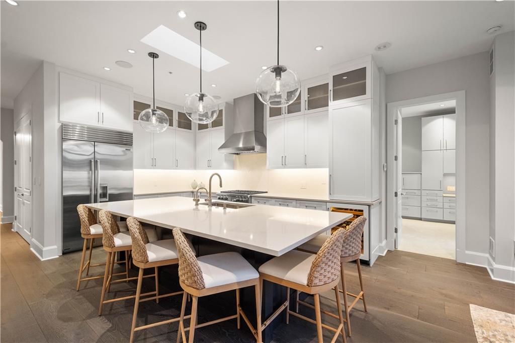 301 Fifth Avenue, Unit 720 Pittsburgh, PA 15222 - Photo 6 of 49 a dining room with stainless steel appliances kitchen island a table and chairs