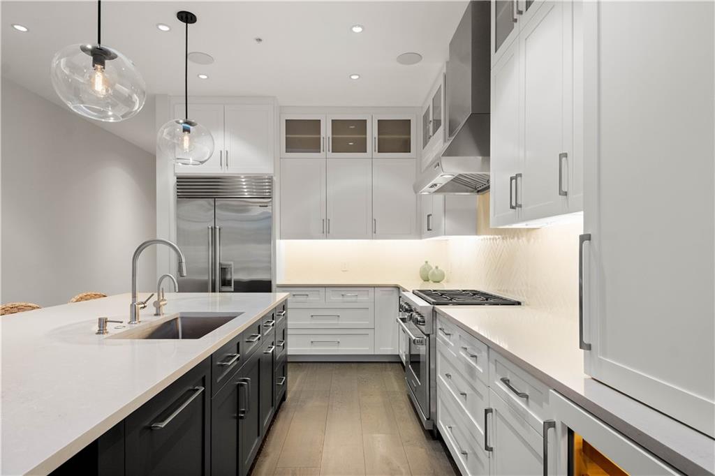 301 Fifth Avenue, Unit 720 Pittsburgh, PA 15222 - Photo 8 of 49 a kitchen with stainless steel appliances a sink stove and cabinets