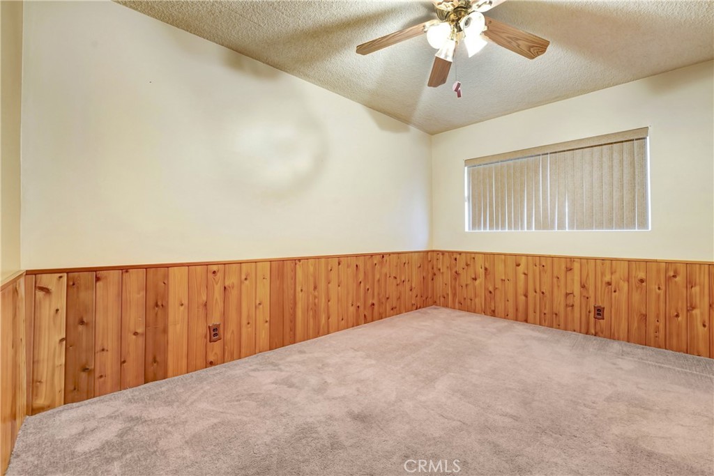 1636 Bentley Place Glendora, CA 91740 - Photo 12 of 25 a view of an empty room with a chandelier fan