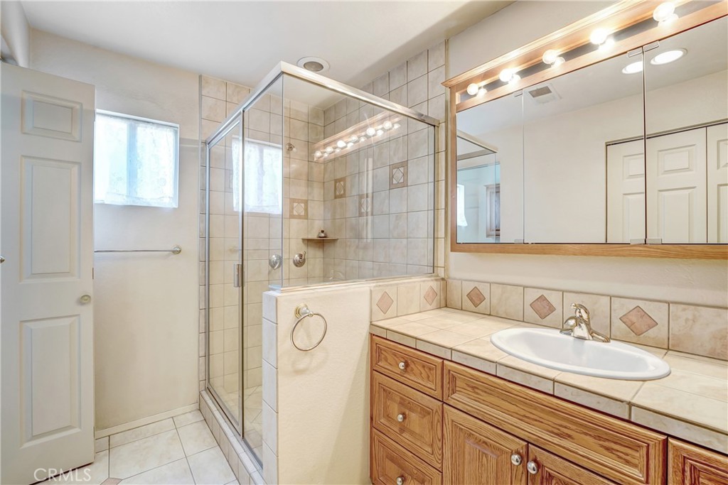 1636 Bentley Place Glendora, CA 91740 - Photo 19 of 25 a bathroom with a sink and a mirror