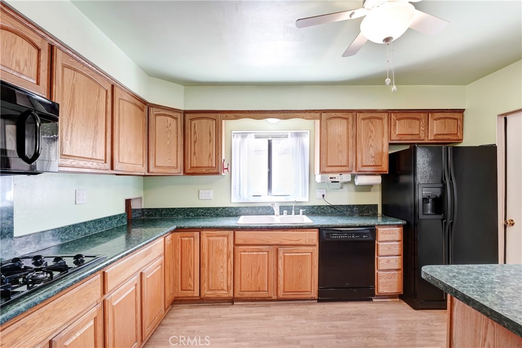 1636 Bentley Place Glendora, CA 91740 - Photo 5 of 25 a kitchen with stainless steel appliances granite countertop a stove a sink dishwasher and a refrigerator