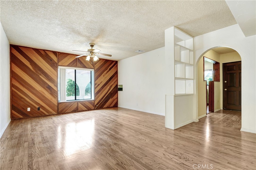 1636 Bentley Place Glendora, CA 91740 - Photo 7 of 25 a view of a livingroom with wooden floor and a ceiling fan