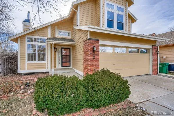 a front view of a house with a garage