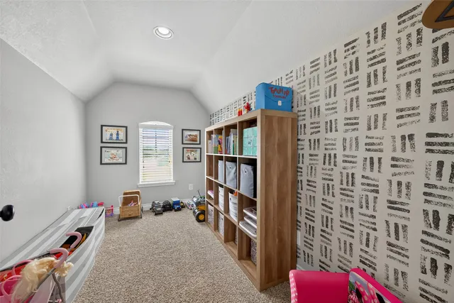 a view of a livingroom with furniture and toys