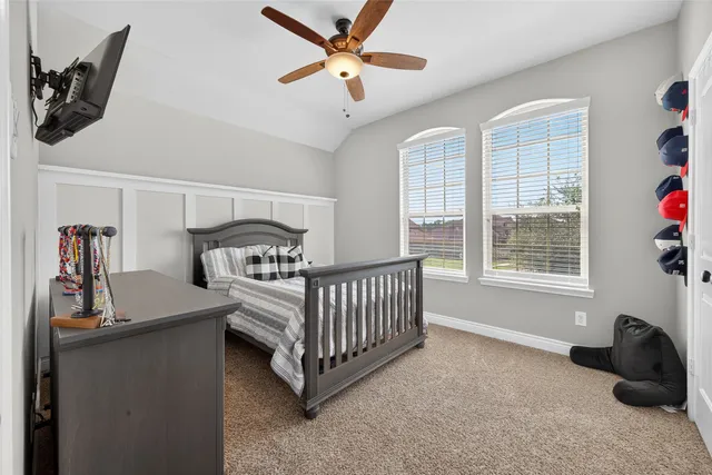 a bedroom with furniture and a window