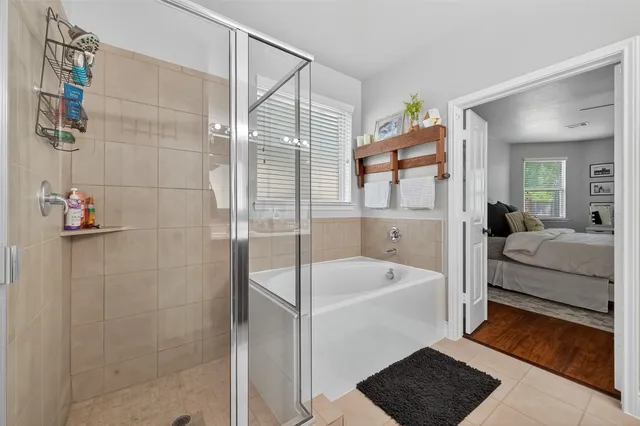 a bathroom with a tub a sink and mirrors