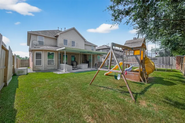 a view of a house with a park
