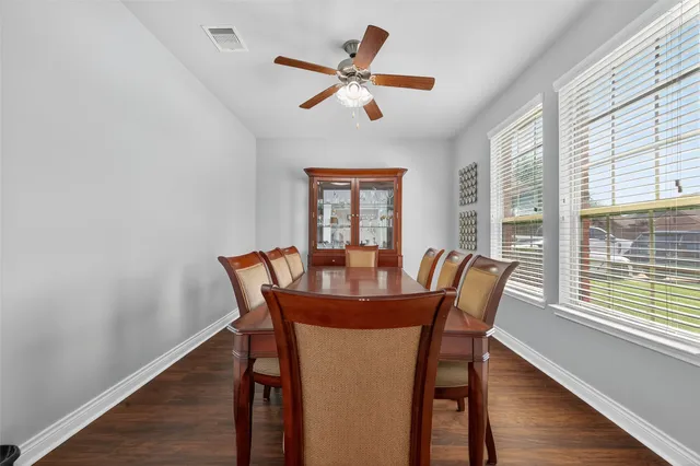 a view of a dining room with furniture window and wooden floor