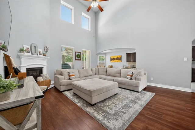 a living room with furniture and a fireplace